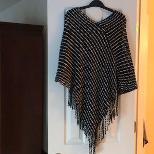 Sheer black and white poncho.